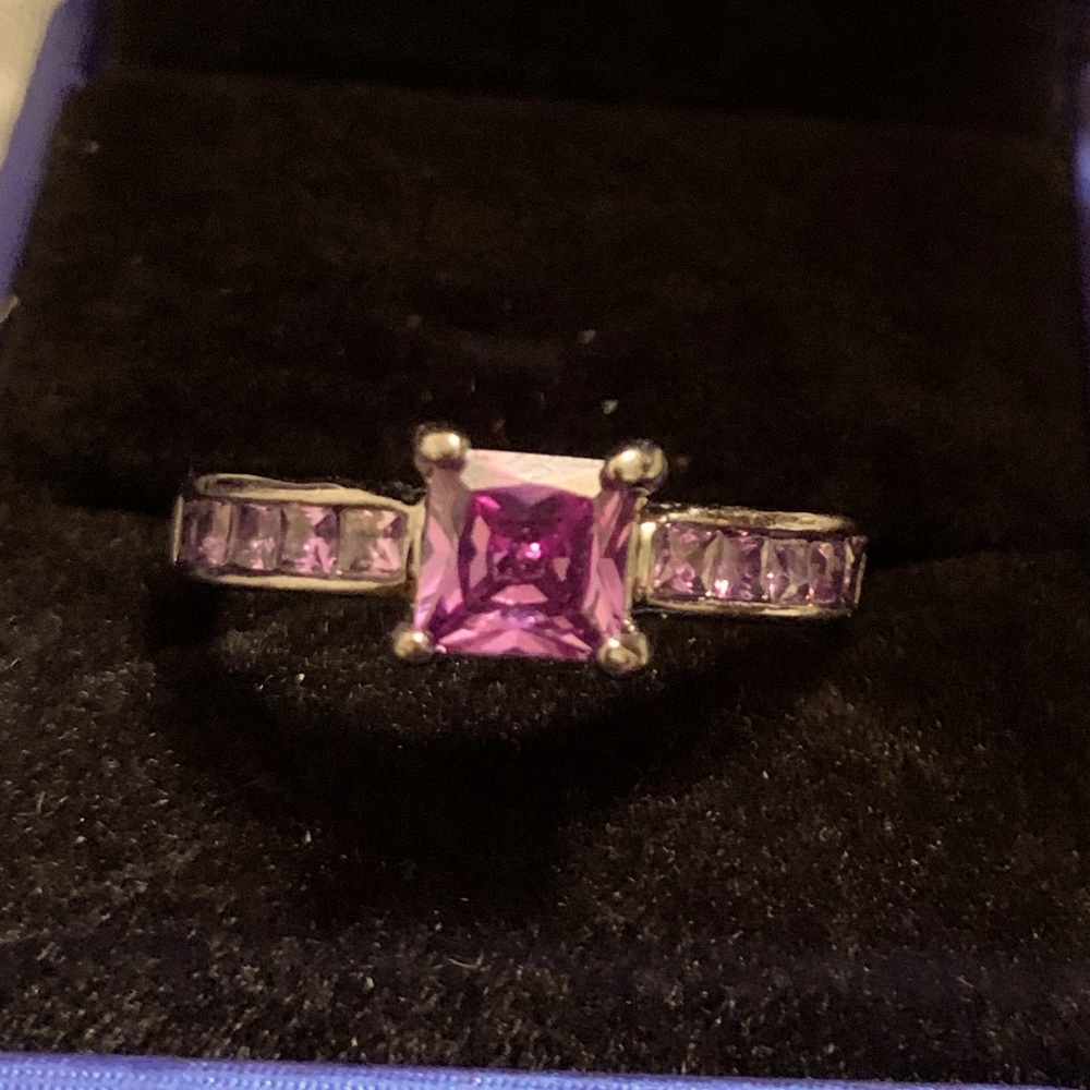 Black stainless steel rind with purple cubic zirconium
